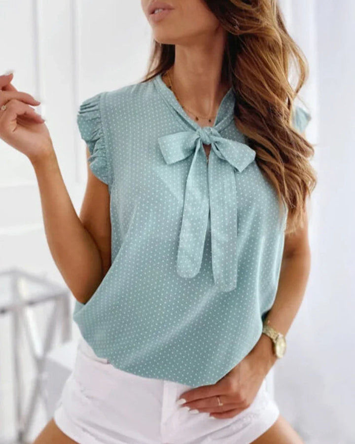 Blouse sans manches avec volants et détail de nœud