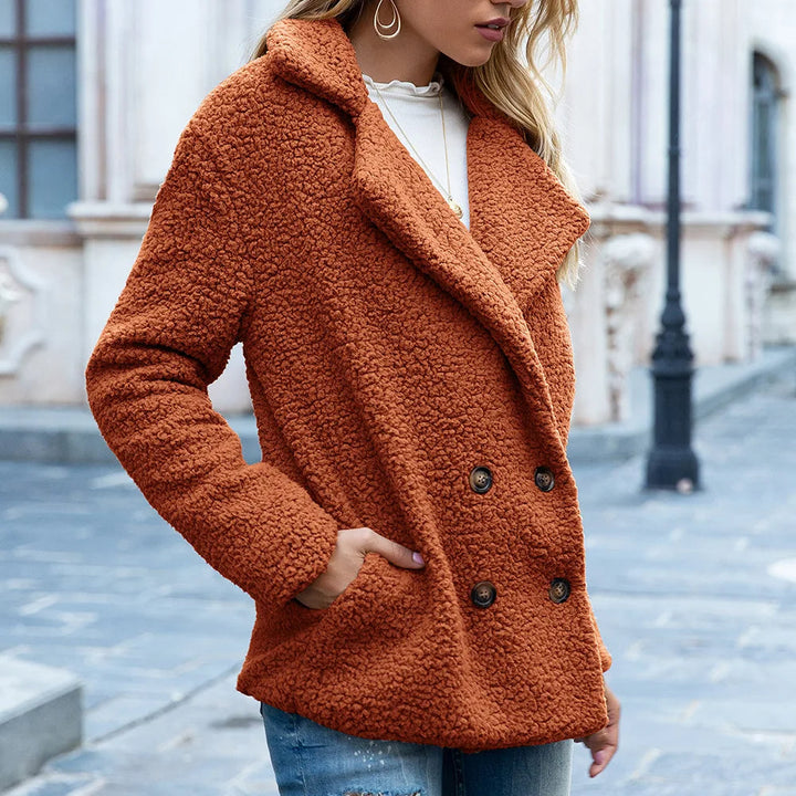 Manteau mi-long avec boutons double-breasted chic chaleur avec une silhouette intemporelle