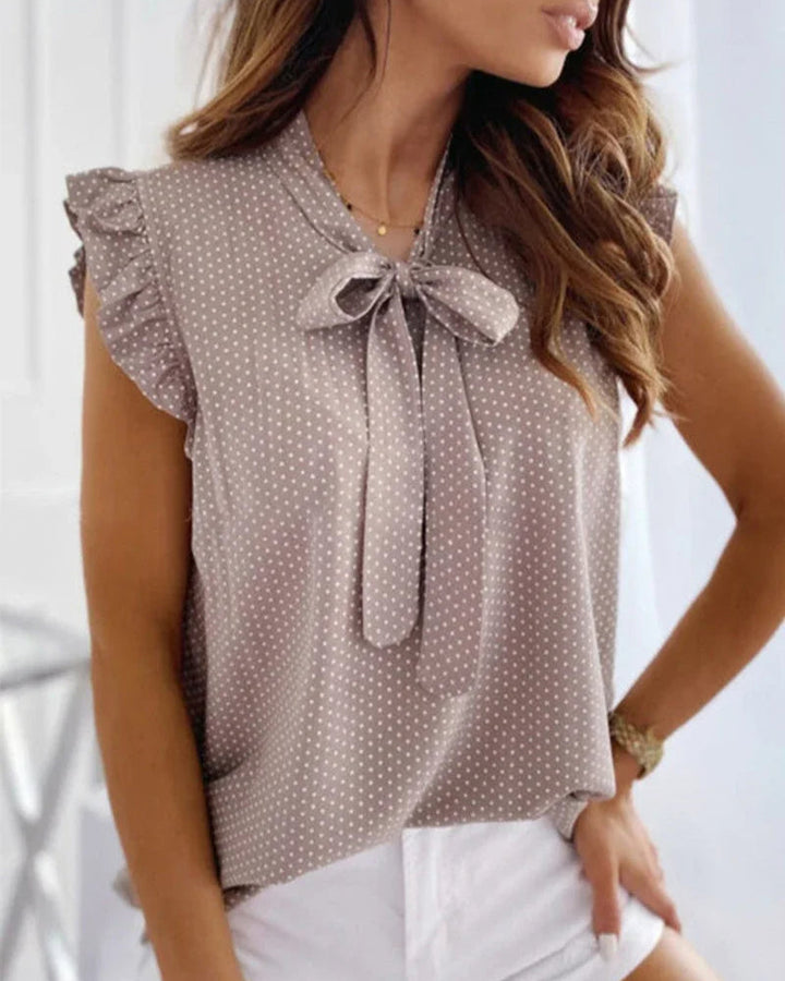 Blouse sans manches avec volants et détail de nœud