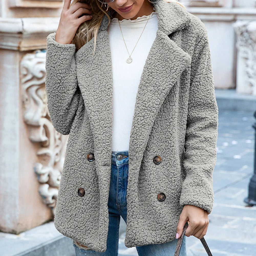 Manteau mi-long avec boutons double-breasted chic chaleur avec une silhouette intemporelle